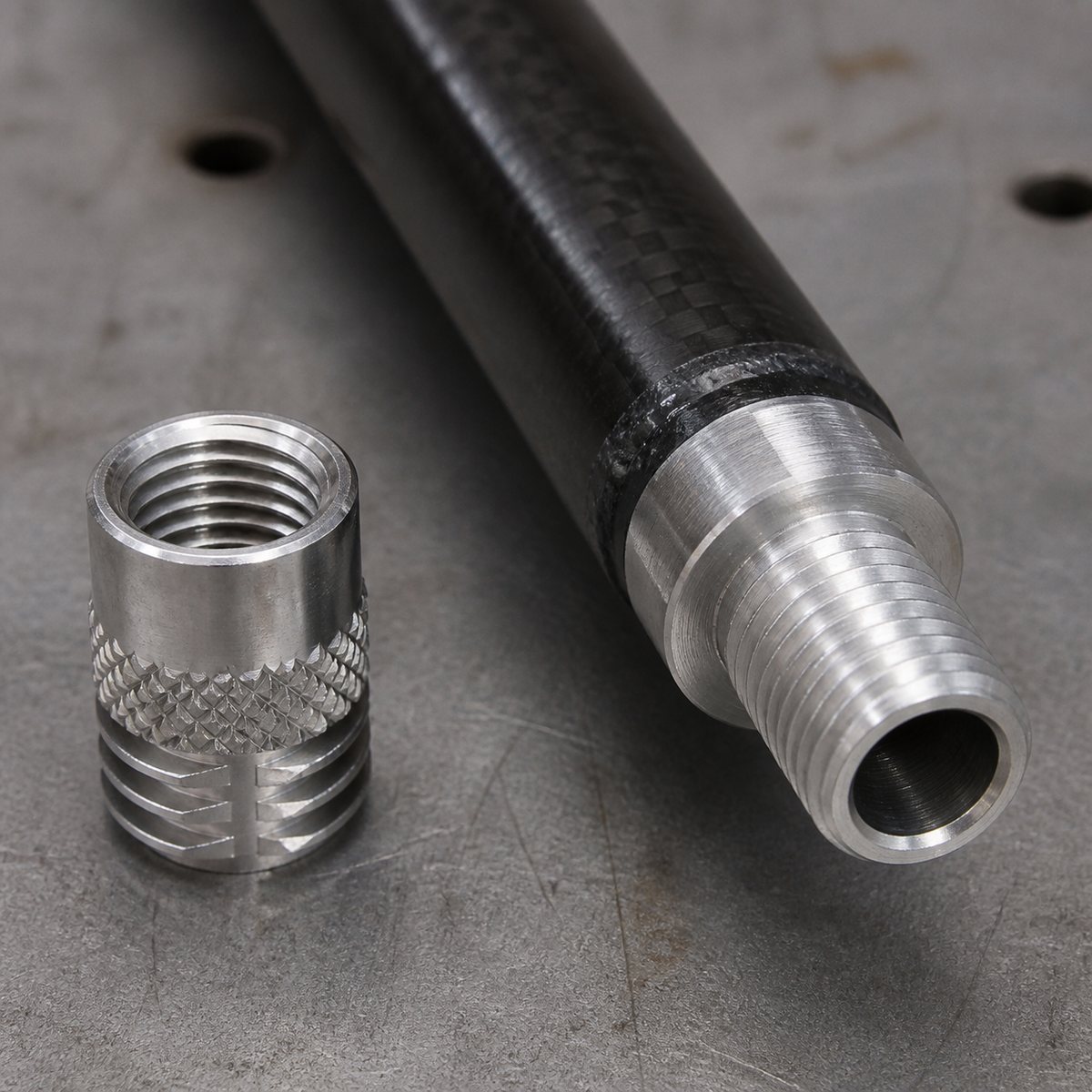 Male threaded metal insert bonded into a carbon fiber rod