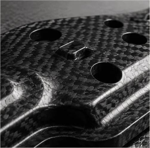 Forged carbon fiber material with chopped reinforcement appearance